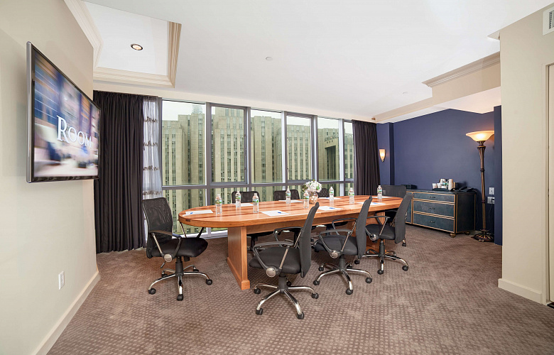 Photo 3 of Meeting Room with a view of NYC that can accommodate up to 8 people and including amenities, such as TV, coffee/tea/water and Wifi. 